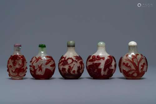 Five Chinese red overlay snowflake glass snuff bottles,