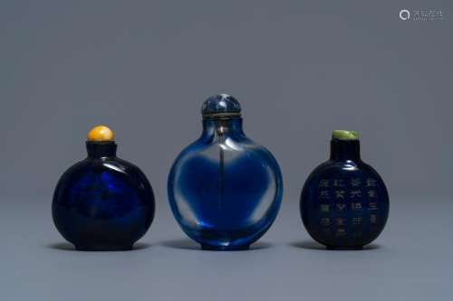 Three Chinese transparent blue glass snuff bottles, one