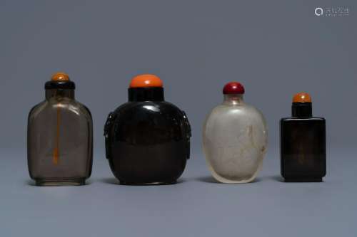 Four Chinese smokey quartz and simulating glass snuff