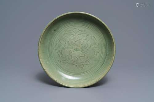 A Chinese Longquan celadon dish with underglaze peony