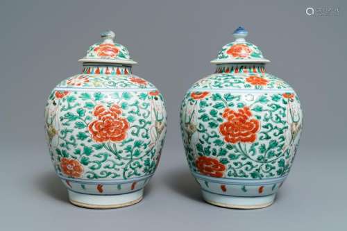 A pair of Chinese wucai vases and covers with boys