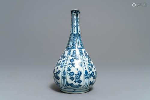 A Chinese blue and white bottle vase with flowers,