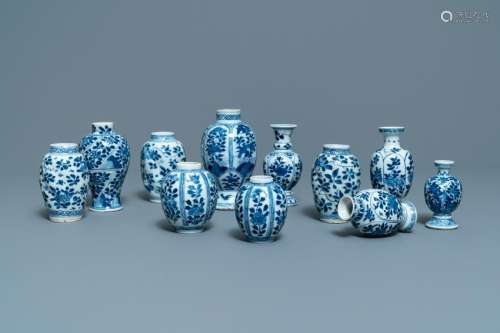 Eleven small Chinese blue and white vases with floral