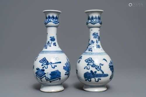 A pair of Chinese blue and white vases with antiquities