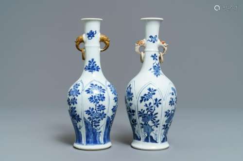 A pair of Chinese blue and white vases with parcel-gilt