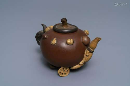 A Chinese Yixing stoneware relief-decorated teapot with