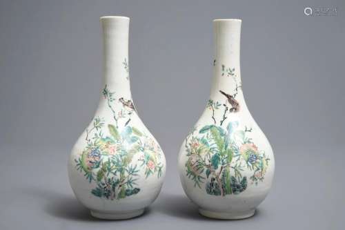 A pair of Chinese famille rose bottle vases with birds