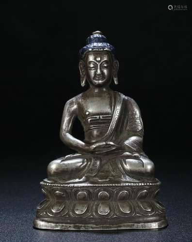 A NICE CARVED SILVER SAKYAMUNI FIGURE TIBET