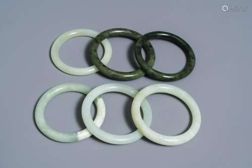 Six Chinese celadon and spinach green jade bangles,