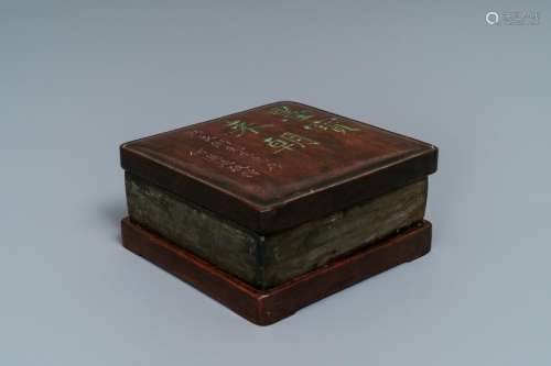 A square Chinese inscribed wood-encased duan inkstone,