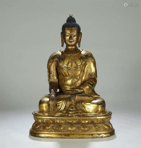 A LARGE GILT BRONZE FIGUER OF SAKYAMUNI