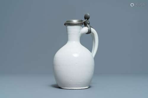 A white Dutch Delft jug with pewter cover, 17th C.