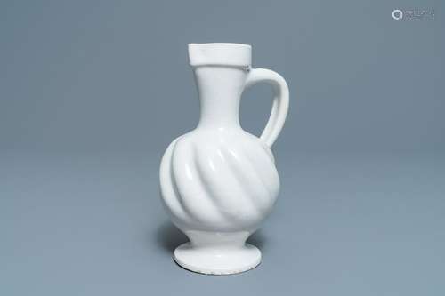 A white Dutch Delft gadrooned jug, 17th C.