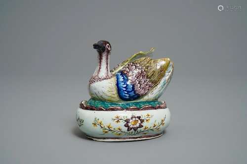 A polychrome Dutch Delft 'plover' butter tub and cover,