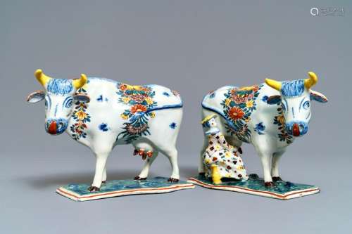 Two polychrome Dutch Delft models of cows on bases,