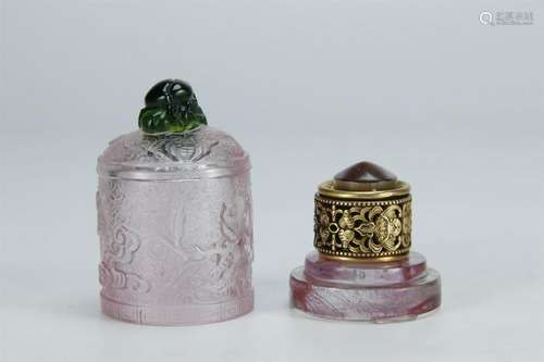 A GILT BRONZE ARCHER'S RING IN PINK GLASS BOX