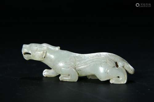 A PALE CELADON/RUSSET JADE CARVED BEAST FIGURE