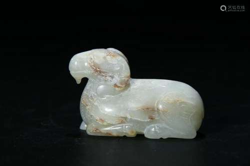 A PALR CELADON/RUSSET JADE CARVED RAM