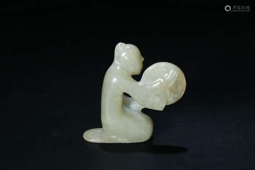 A PALE CELADON JADE CARVED FIGURE