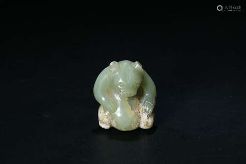 A PALE CELADON JADE CARVED BEAR FIGURE