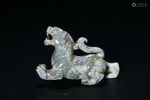 A PALE CELADON JADE CARVED BEAST FIGURE