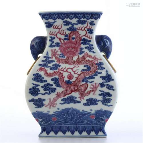 CHINESE PORCEL A IN BLUE AND WHITE IRON RED DRAGON