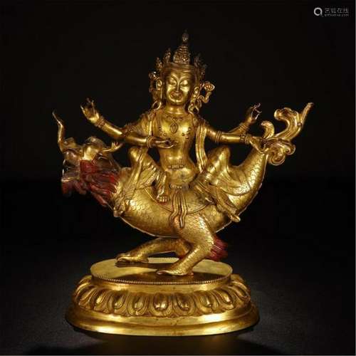 TIBETAN GILT BRONZE BUDDHIST GUARDIAN ON DRAGON