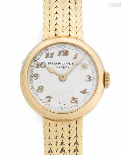 Patek PhilippeRunde, mechanische Armbanduhr 50er Jahre mit Handaufzug in 750 Gelbgoldgehäuse und