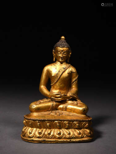 A BRONZE GILDED SAKYAMUNI, 16TH CENTURY