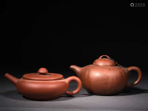 TWO SIGNED YIXING-GLAZED TEAPOTS, 20TH CENTURY