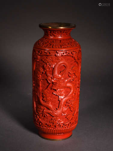 A CARVED CINNABAR LACQUER DRAGON AND CLOUDS VASE, REPUBLIC PERIOD