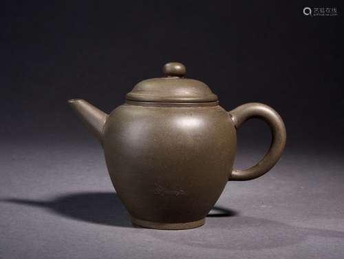 A YIXING-GLAZED TEAPOT, 19TH CENTURY