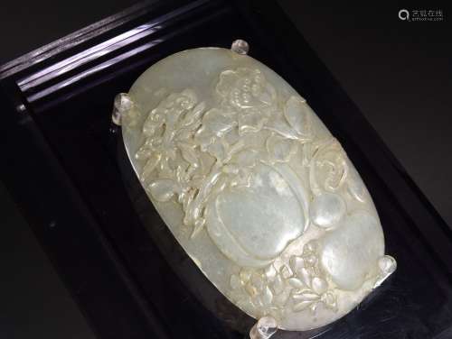 A CREAMY WHITE OVAL SHAPED JADE PLAQUE, 18TH CENTURY
