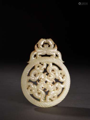 A CREAMY WHITE JADE RETICULATED AMULET, 18TH CENTURY