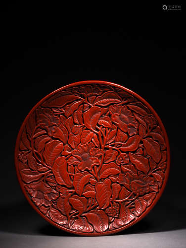 A CARVED CINNABAR LACQUER PLATE,19TH CENTURY