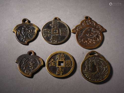 A GROUP OF BRONZE AMULETS, 19TH CENTURY