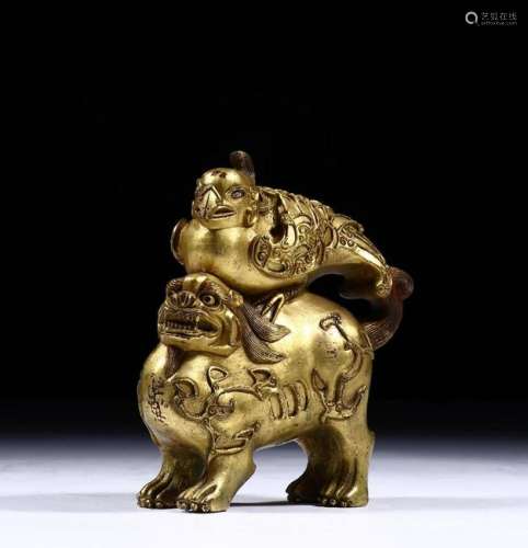 A CHINESE COPPER GILT MYTHICAL BEAST STATUE, QING