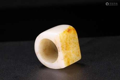 A CHINESE WHITE JADE THUMB RING, QING DYNASTY