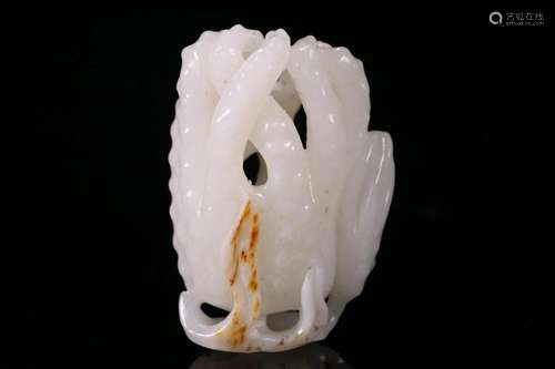 A CHINESE WHITE JADE FIGURE OF SECHIUM EDULE, QING