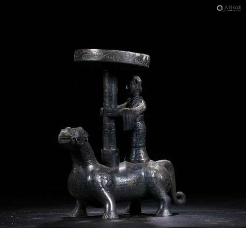 A CHINESE ARCHAIC BRONZE MYTHICAL BEAST SHAPED CANDLE