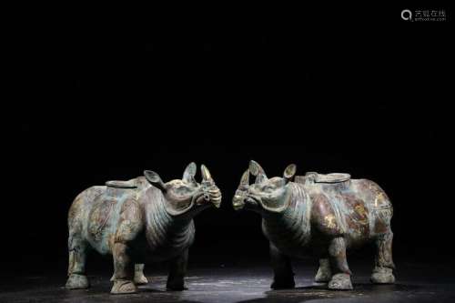 A PAIR OF CHINESE RHINOCEROS SHAPED ARCHAIC BRONZE