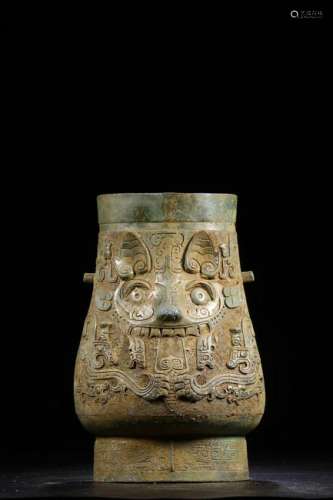 A CHINESE ARCHAIC BRONZE WINE VESSEL WITH MYTHICAL