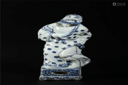 A CHINESE BLUE AND WHITE FIGURE OF IMMORTAL, QING