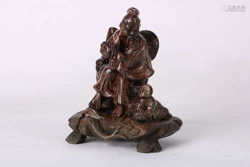 A CHINESE SOAPSTONE FIGURE OF PEOPLE, QING DYNASTY