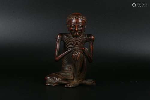 A CHINESE ALOESWOOD FIGURE OF LUOHAN, EARLY QING