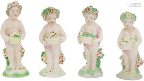 Een set van vier porseleinen Putti gedecoreerd met bloemen. 19e eeuw.Randschade. Afm. 10 x 3,5 cm.