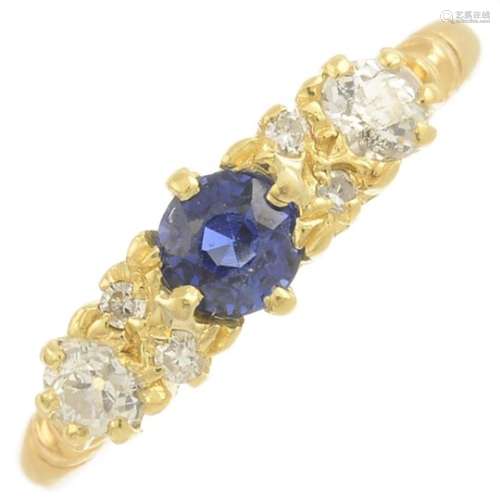 A sapphire and diamond dress ring.Estimated total diamond weight 0.20ct.Ring size L.