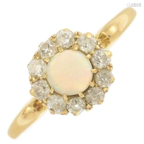 An early 20th century 18ct gold opal and diamond cluster ring.Estimated total diamond weight