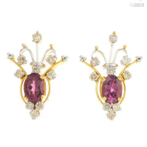 A pair of diamond and garnet earrings.Total diamond weight 0.69ct,