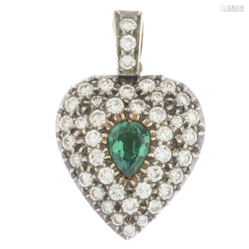 An emerald and diamond heart locket pendant.Estimated total diamond weight 0.75ct.Length 2.3cms.